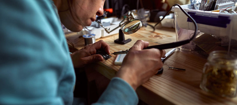 Person soldering electronic components