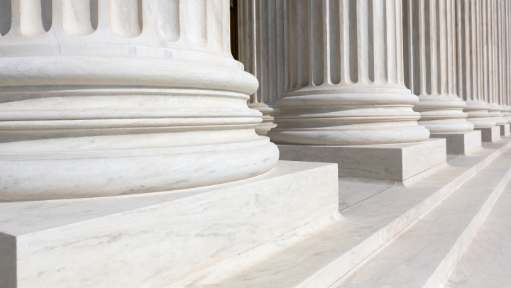 Photo of columns on a white building