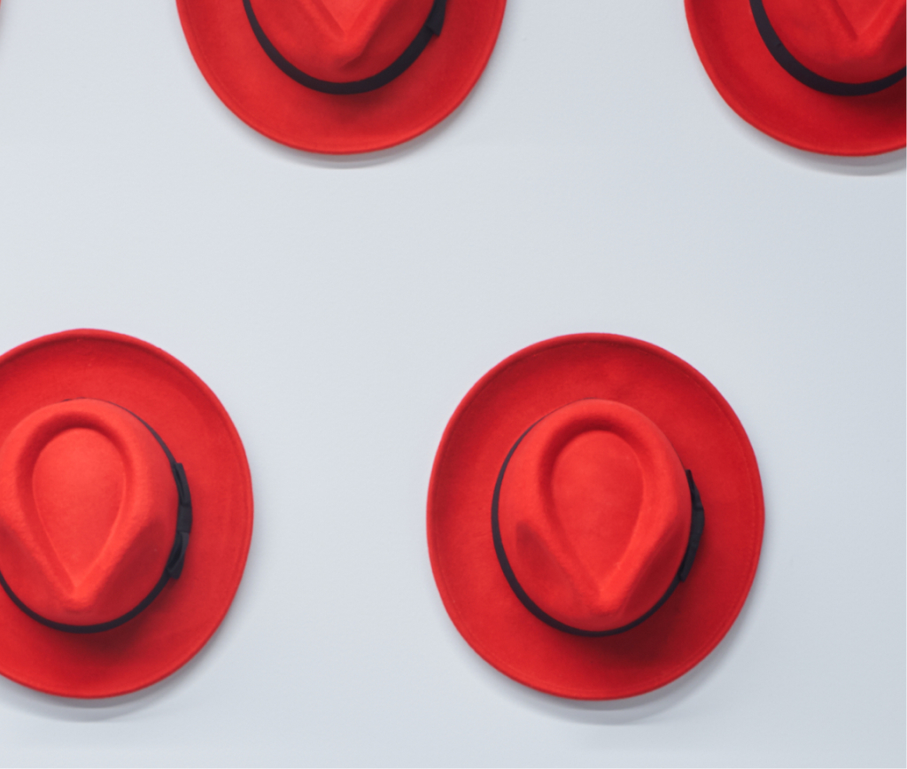 Image of red hats on a white surface