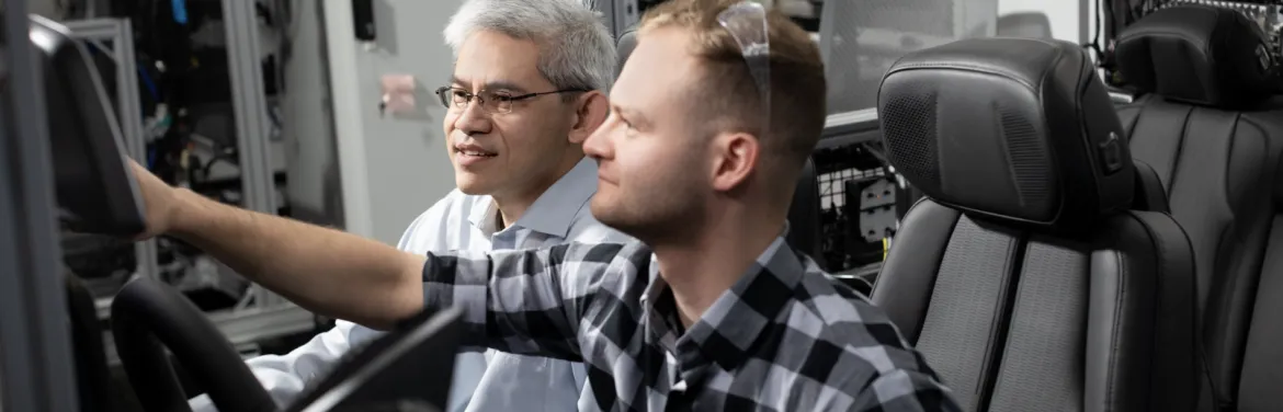 two men testing an in-vehicle operating system