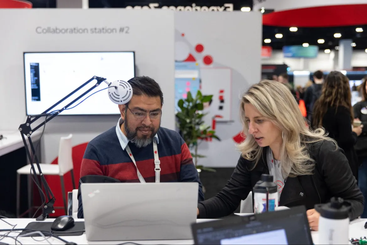 Photo of 1:1 interview in the Experience Zone booth at Red Hat Summit 2024