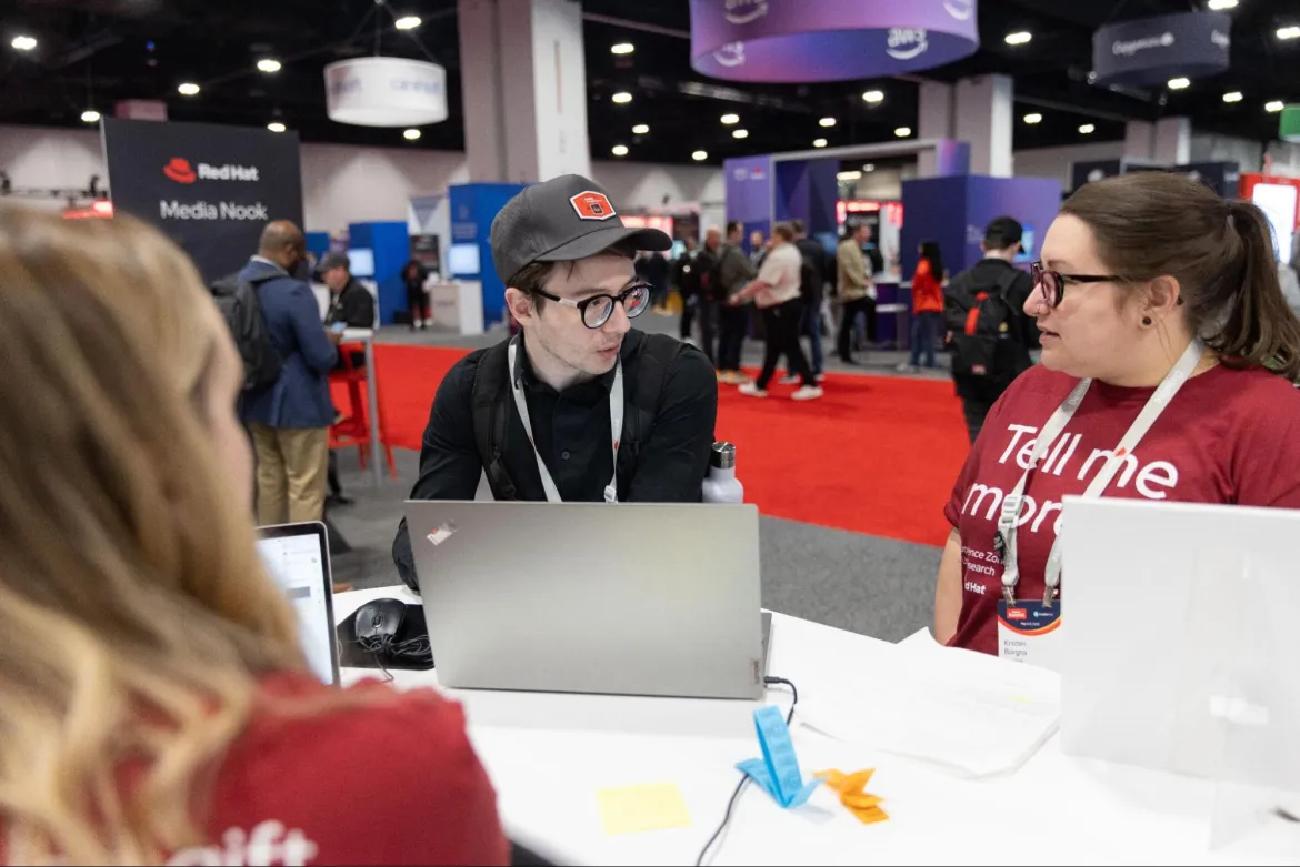 Photo of 1:1 interview in the Experience Zone booth at Red Hat Summit 2024