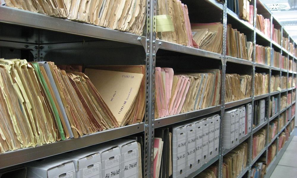 Shelves filled with file folders and file boxes