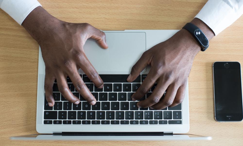 Hands typing on keyboard